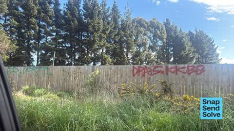 Graffiti on a fence, building or structure, a report photo