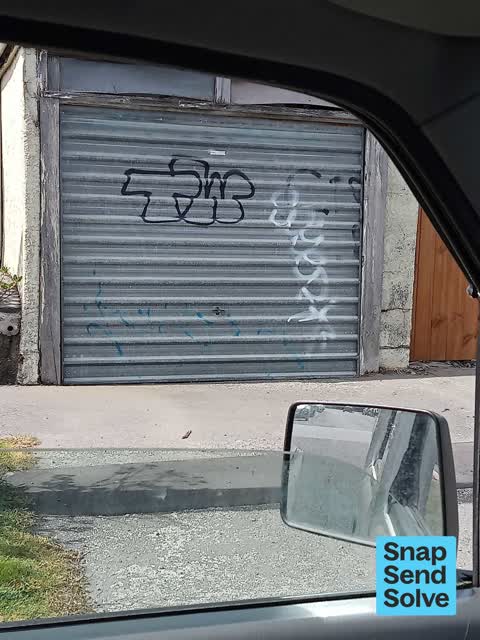 Graffiti on a fence, building or structure, a report photo