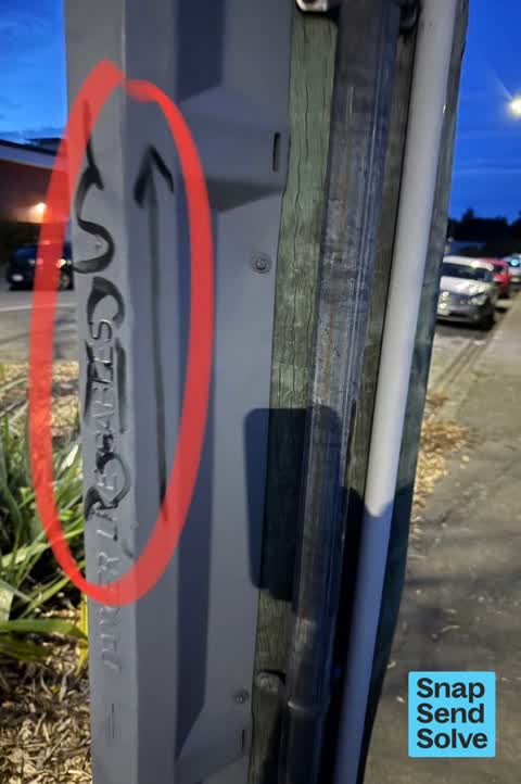 Graffiti on a traffic light pole or cabinet, or wa, a report photo