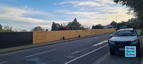 Graffiti on a fence, building or structure, a report photo