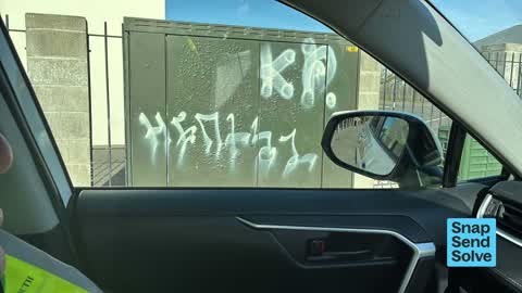 Graffiti on a traffic light pole or cabinet, or wa, a report photo