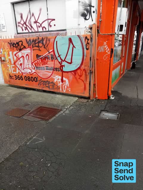 Graffiti on a fence, building or structure, a report photo