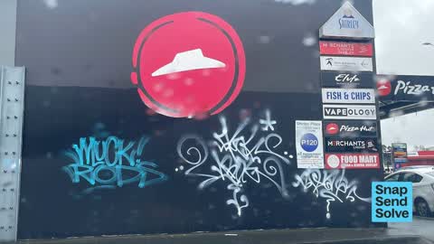 Graffiti on a fence, building or structure, a report photo