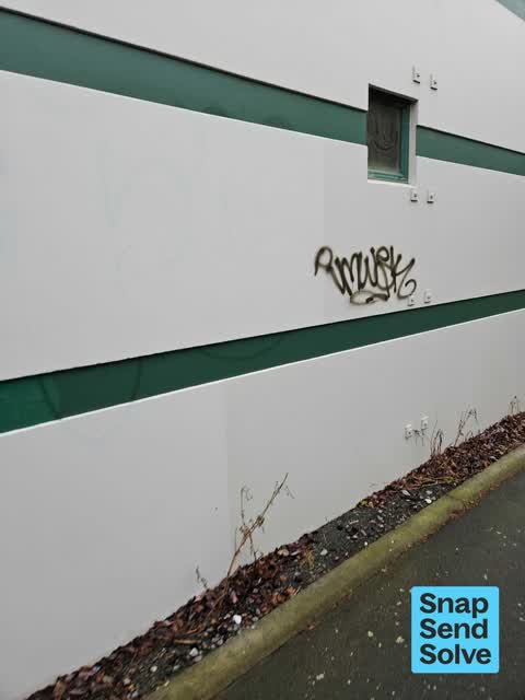 Graffiti on a fence, building or structure — a report photo