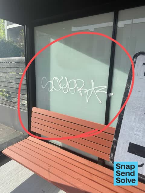 Graffiti on a bus stop or public toilet, a report photo