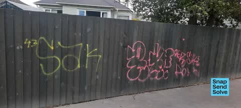 Graffiti on a fence, building or structure — a report photo