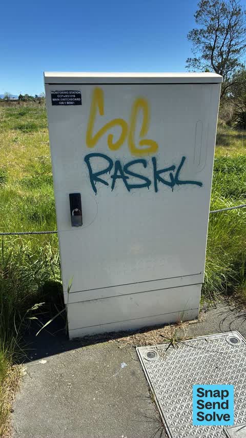 Graffiti on a traffic light pole or cabinet, or wa — a report photo