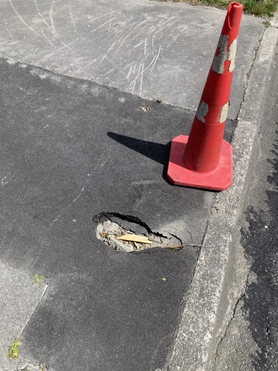 The photograph attached to this pavement - damaged report