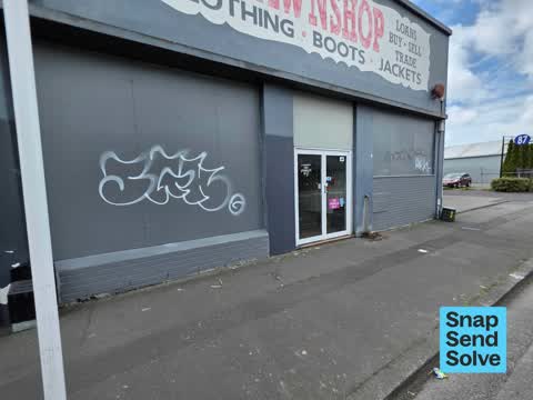 Graffiti on a fence, building or structure — a report photo