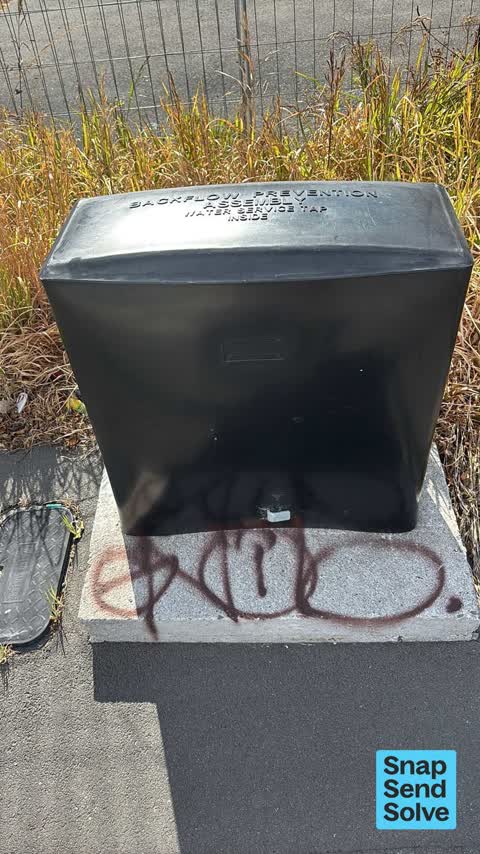 Graffiti on a traffic light pole or cabinet, or wa, a report photo