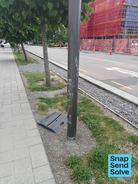 Graffiti on a traffic light pole or cabinet, or wa, a report photo