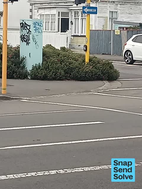 Graffiti on a traffic light pole or cabinet, or wa, a report photo