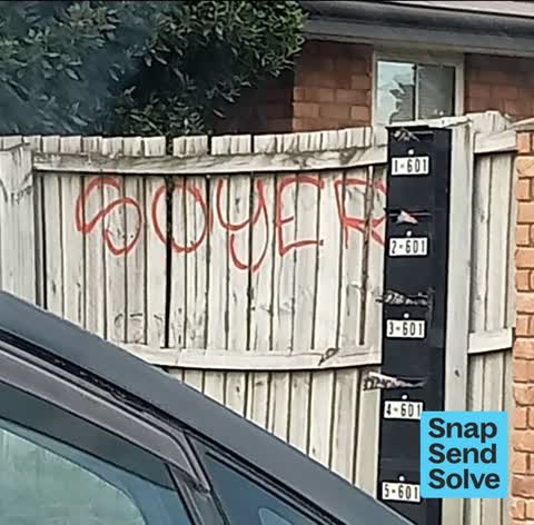 Graffiti on a fence, building or structure, a report photo