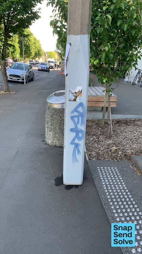 Graffiti on a traffic light pole or cabinet, or wa, a report photo