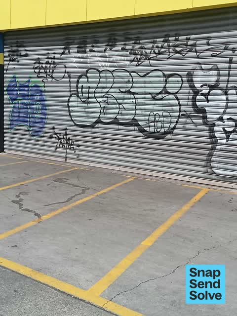 Graffiti on a fence, building or structure, a report photo