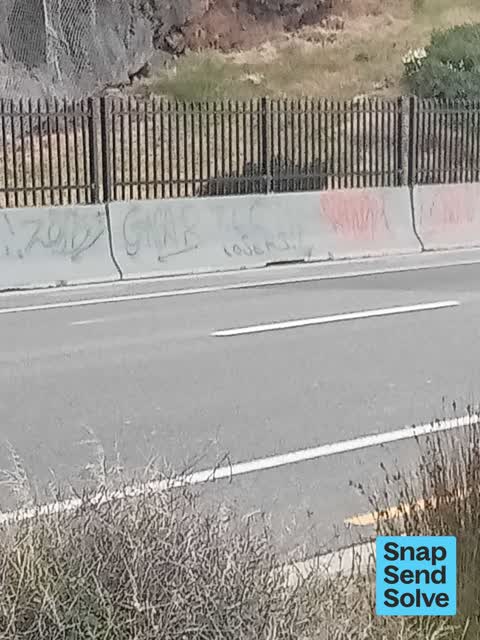 Graffiti on a fence, building or structure — a report photo