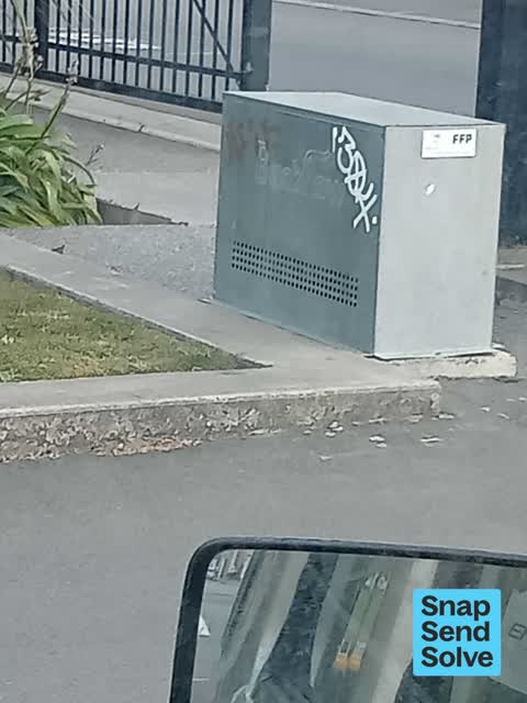 Graffiti on a traffic light pole or cabinet, or wa, a report photo