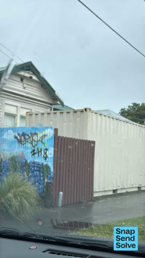 Graffiti on a fence, building or structure — a report photo
