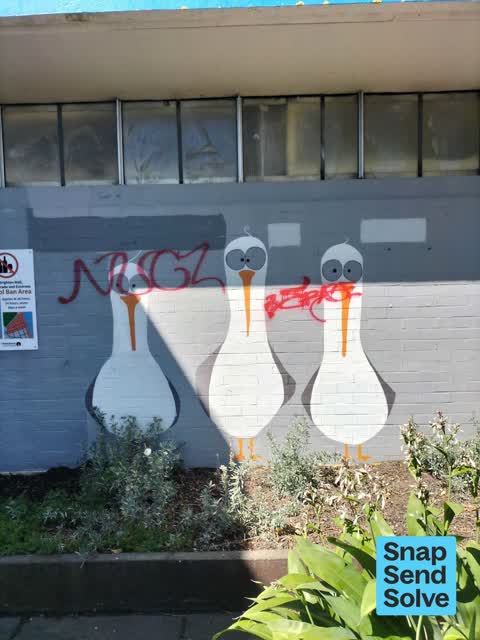 Graffiti on a fence, building or structure, a report photo