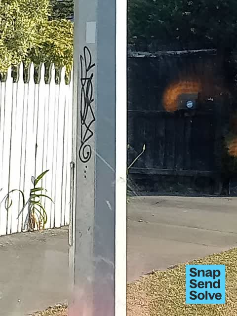 Graffiti on a fence, building or structure, a report photo