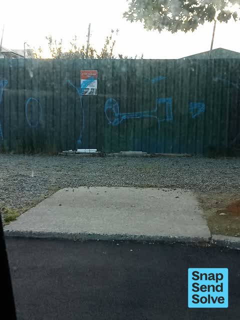 Graffiti on a fence, building or structure, a report photo