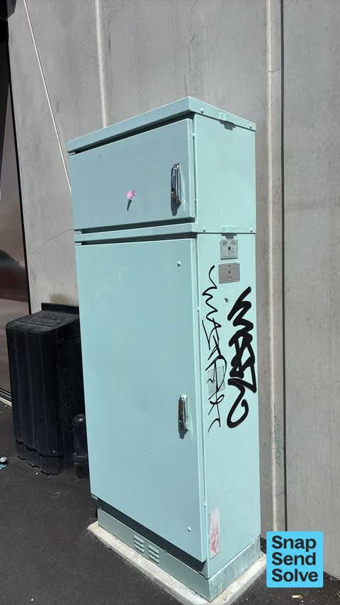 Graffiti on a traffic light pole or cabinet, or wa — a report photo