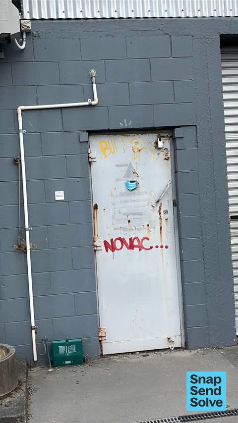 Graffiti on a fence, building or structure, a report photo