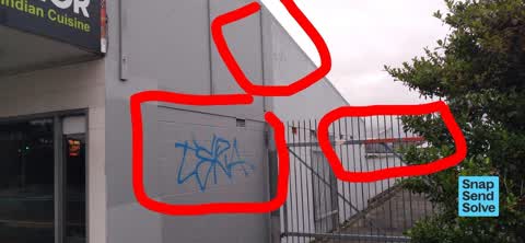 Graffiti on a fence, building or structure, a report photo