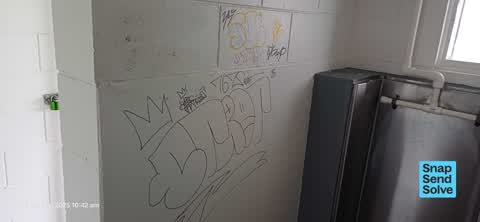 Graffiti on a bus stop or public toilet, a report photo