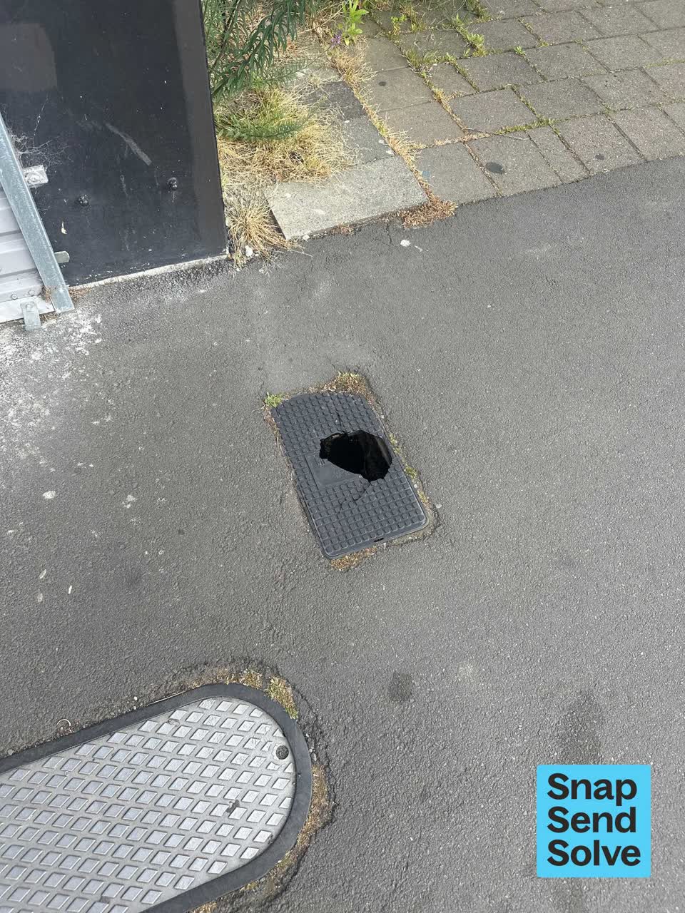 The photograph attached to this pavement - damaged report