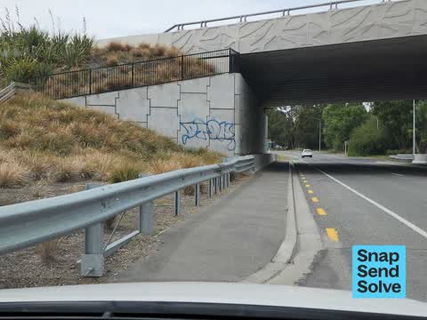 Graffiti on a road, footpath or bridge — a report photo