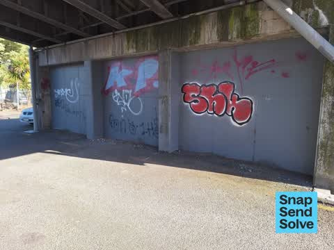 Graffiti on a fence, building or structure, a report photo