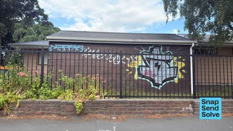 Graffiti on a fence, building or structure, a report photo