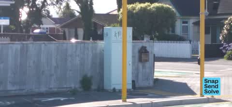 Graffiti on a traffic light pole or cabinet, or wa, a report photo