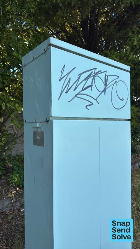 Graffiti on a traffic light pole or cabinet, or wa — a report photo