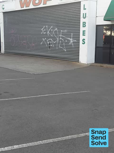 Graffiti on a fence, building or structure, a report photo