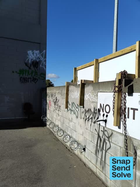 Graffiti on a fence, building or structure — a report photo