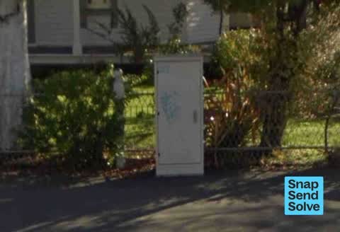 Graffiti on a traffic light pole or cabinet, or wa — a report photo