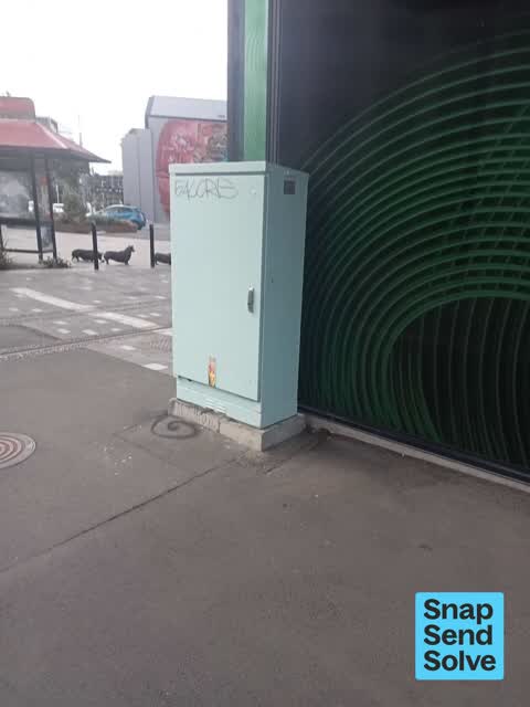 Graffiti on a traffic light pole or cabinet, or wa, a report photo