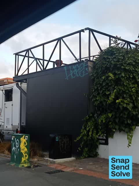 Graffiti on a fence, building or structure — a report photo