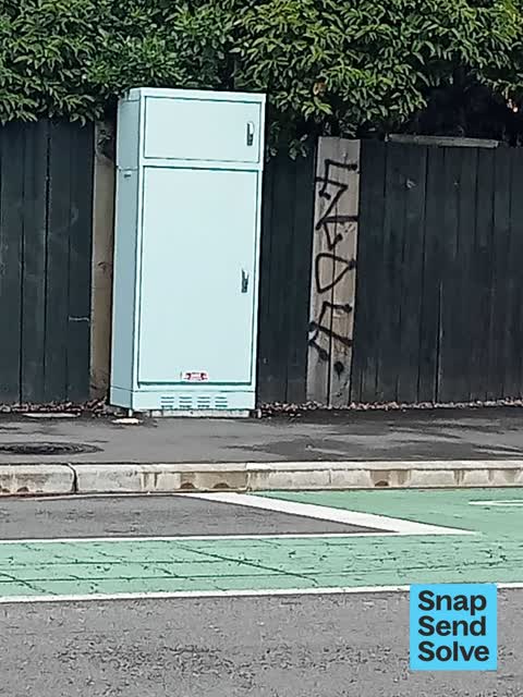 Graffiti on a fence, building or structure — a report photo