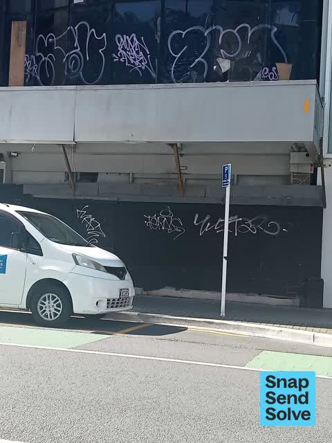 Graffiti on a fence, building or structure — a report photo