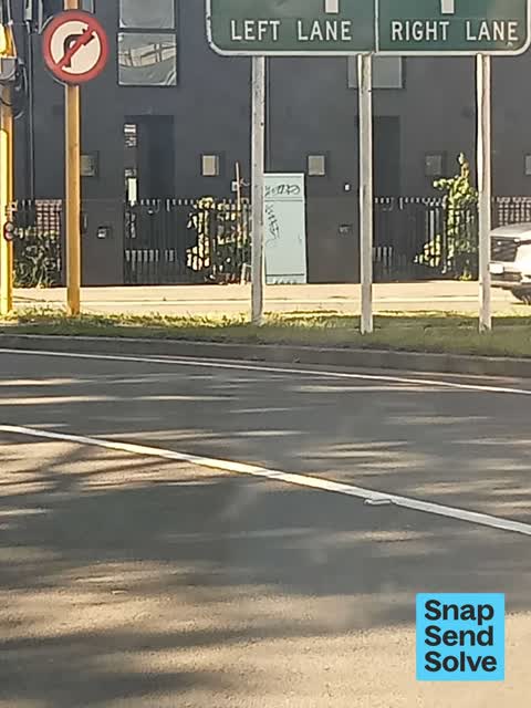 Graffiti on a traffic light pole or cabinet, or wa, a report photo