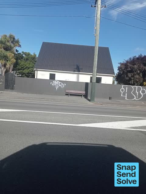 Graffiti on a fence, building or structure, a report photo