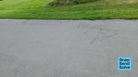 Graffiti on a road, footpath or bridge, a report photo