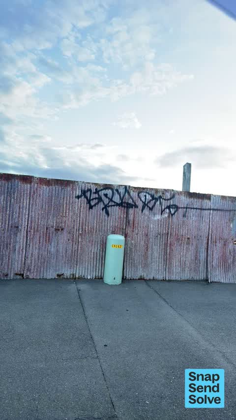 Graffiti on a fence, building or structure, a report photo