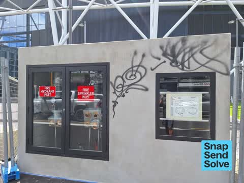 Graffiti on a fence, building or structure, a report photo
