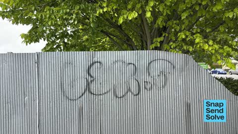 Graffiti on a fence, building or structure, a report photo