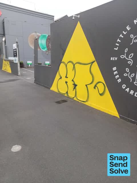 Graffiti on a fence, building or structure, a report photo