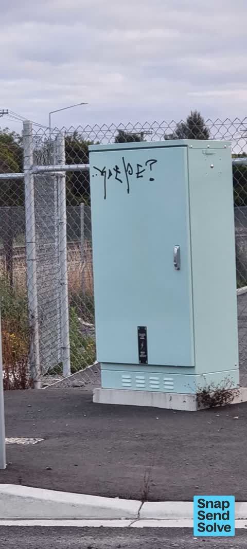 Graffiti on a traffic light pole or cabinet, or wa, a report photo